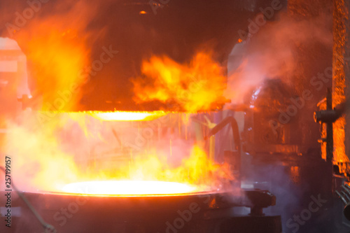 Vyksa, Russia: 12.23.2018. Steel press rolling industrial workshop. Hot iron stamping of train and wagon wheels. Industrial details of metallurgic factory or plant.