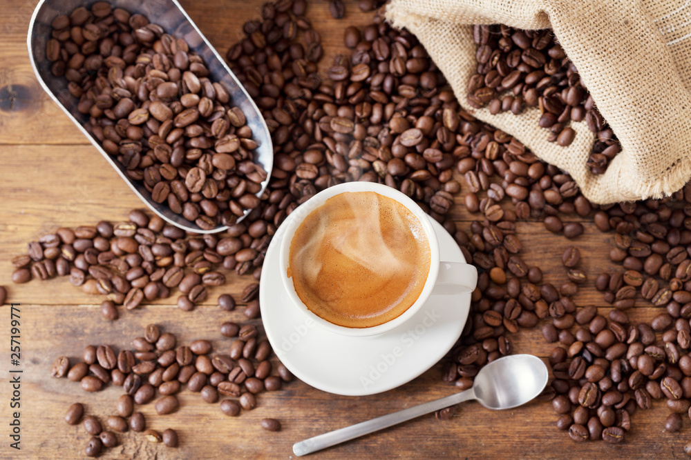 cup of coffee and coffee beans, top view cup of coffee and coffee beans, top view