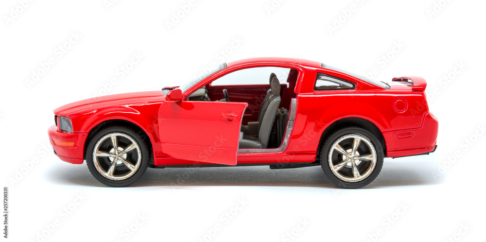 Photo of red toy model car isolated on white background Photo of red toy model car isolated on white background