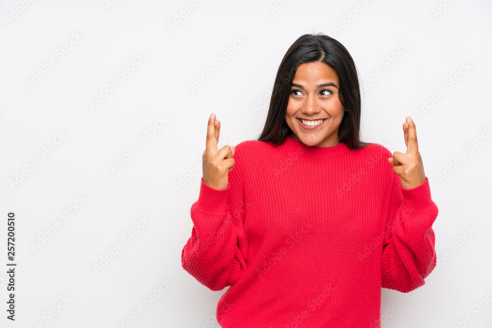 Young Colombian girl with glasses with fingers crossing Young Colombian girl with glasses with fingers crossing