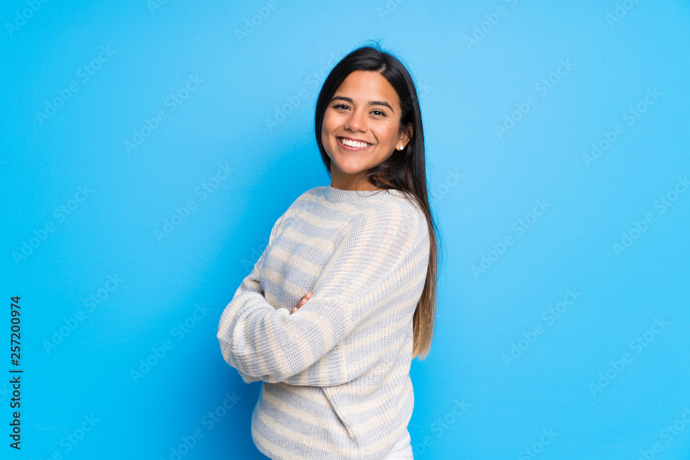 Young Colombian girl with sweater with arms crossed