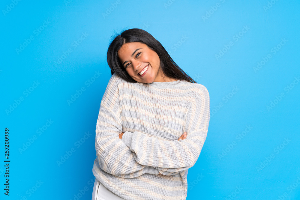 Young Colombian girl with sweater smiling Young Colombian girl with sweater smiling