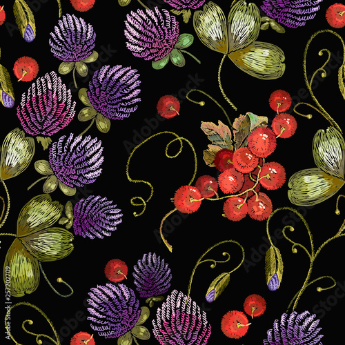Embroidery flowers clover and red currant seamless pattern. Fashionable template for design of clothes
