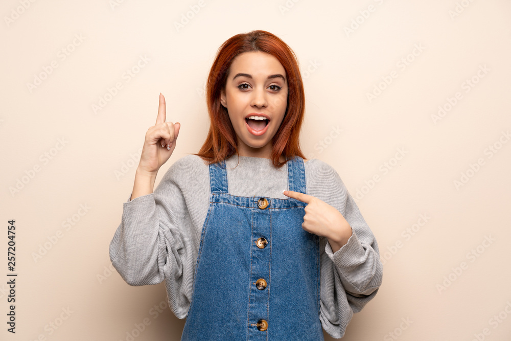 Young redhead woman over isolated background with surprise and shocked facial expression Young redhead woman over isolated background with surprise and shocked facial expression