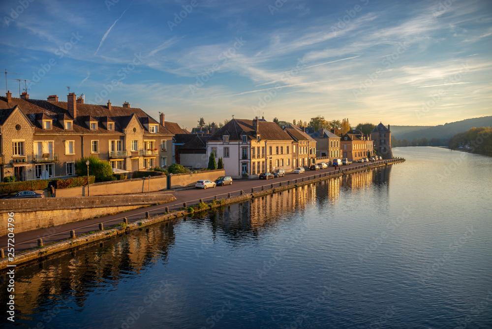 Sunset on Yonne river, reflection of houses in the water, Burgundy, France
