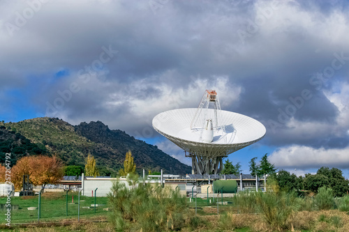  Presiding over the complex with a large antenna exploring the deep space  surrounded by nature. Photograph made in Robledo de Chavela  Madrid  Spain.