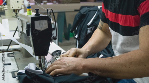 A man sewing