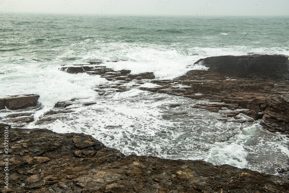 waves covering the rocks waves covering the rocks