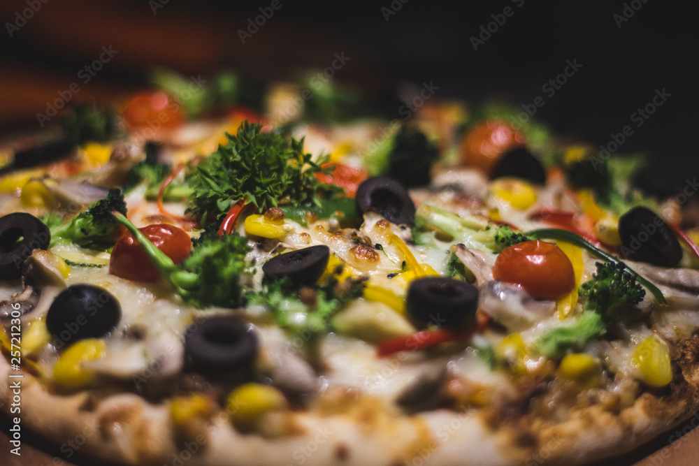 Italian fully loaded veg cheese Pizza on the table Italian fully loaded veg cheese Pizza on the table