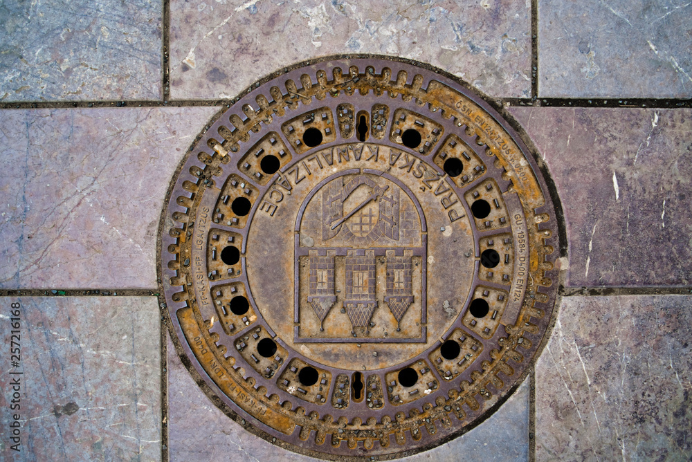 Traditional manhole cover for street hatchway in Prague. Czech republic