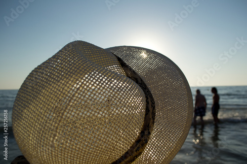 Women's hat, beach on the coast of the Atlantic Ocean.