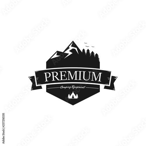 Premium campaign equipment vintage badge with mountain and forest background