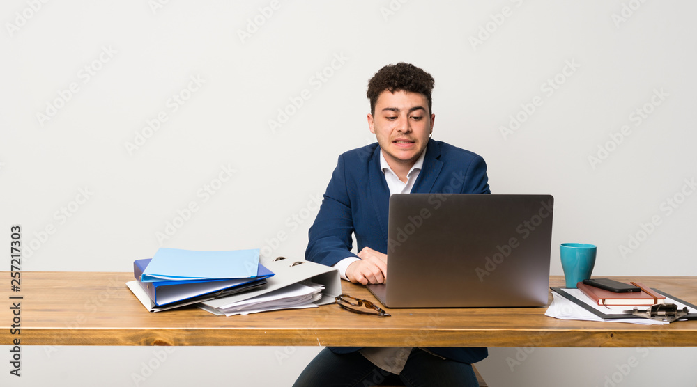 Business man in a office with confuse face expression Business man in a office with confuse face expression