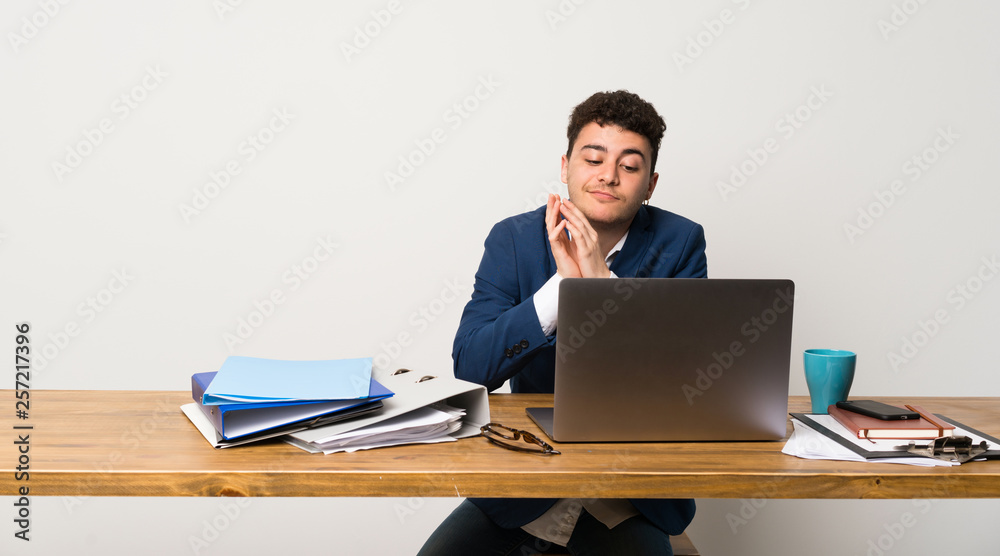 Business man in a office scheming something Business man in a office scheming something