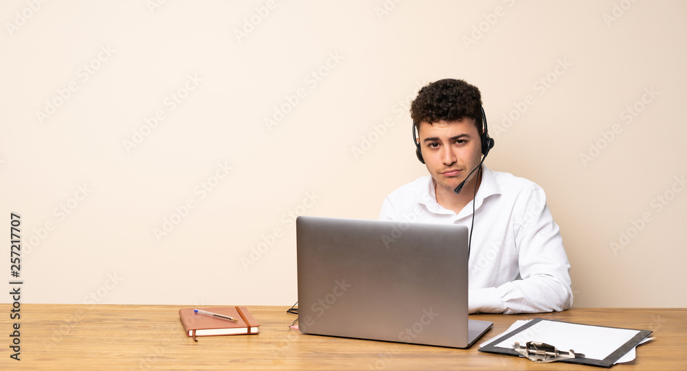 Telemarketer man with sad and depressed expression Telemarketer man with sad and depressed expression