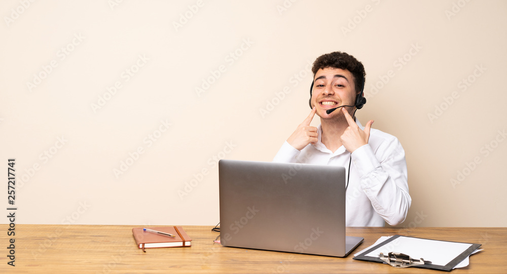 Telemarketer man smiling with a happy and pleasant expression Telemarketer man smiling with a happy and pleasant expression