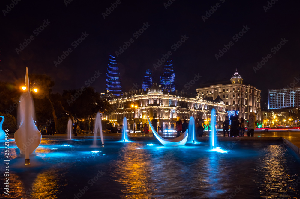 View of swans fountains  in the National Seaside Park at night, Baku city, Azerbaijan