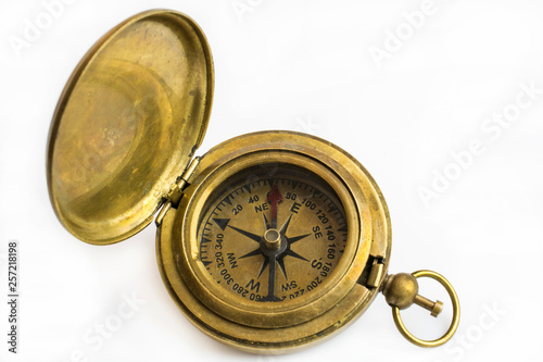 Bronze compass close-up isolated on a white background.