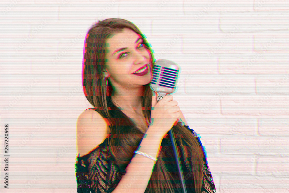 Young woman in black dress with microphone, glitch effect Young woman in black dress with microphone, glitch effect