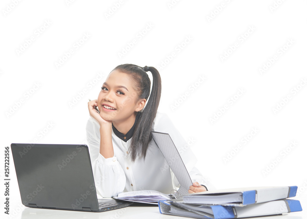 Office lady in white shirt and ponytail hair using a laptop and file Office lady in white shirt and ponytail hair using a laptop and file