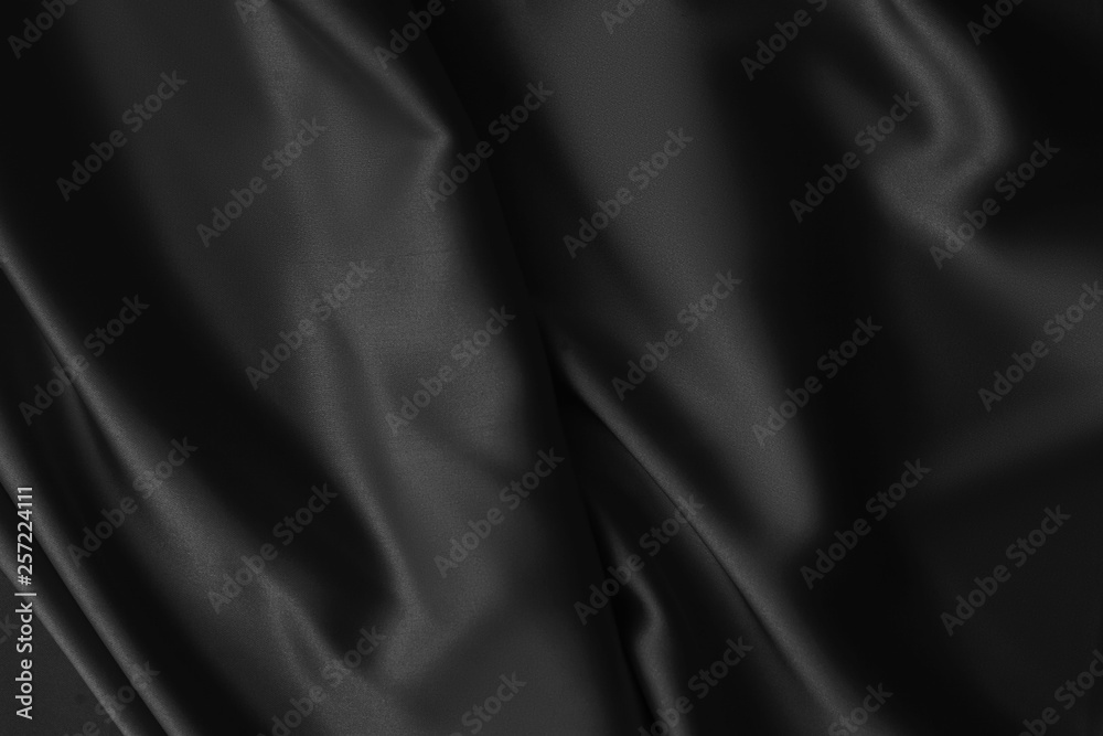 Fototapeta premium Black luxury wavy rippled glossy silk drapery cloth fabric