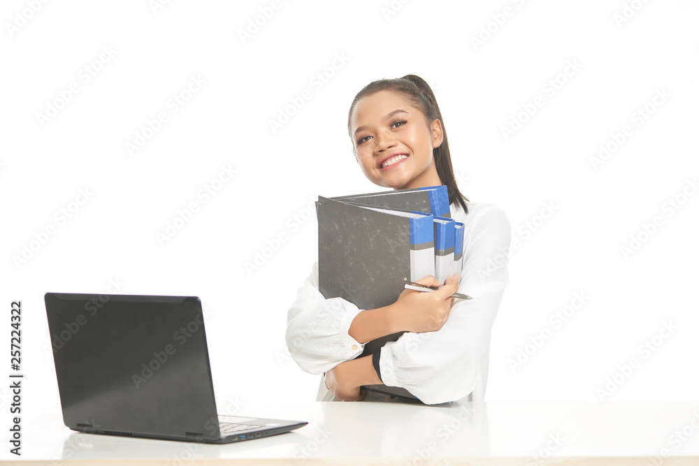 Office lady in white shirt and ponytail hair using a laptop and file Office lady in white shirt and ponytail hair using a laptop and file