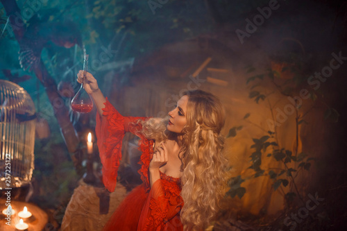Photo pretty young lady preparing a potion to bewitch her beloved boyfriend, girl with
