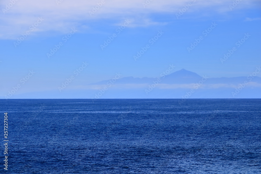 View of Tenerife island with the volcano Teide with the Atlantic Ocean in between