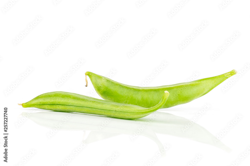 Group of two whole fresh green sugar snap pea isolated on white background Group of two whole fresh green sugar snap pea isolated on white background