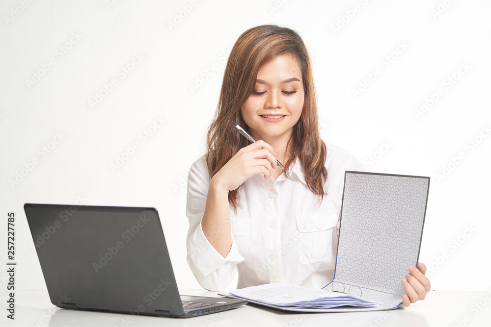Office Lady In White Shirt using Laptop and File Office Lady In White Shirt using Laptop and File