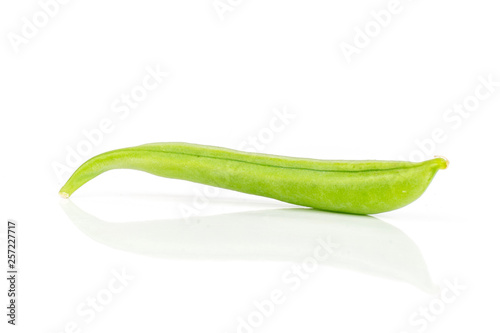 One whole fresh green sugar snap pea isolated on white background