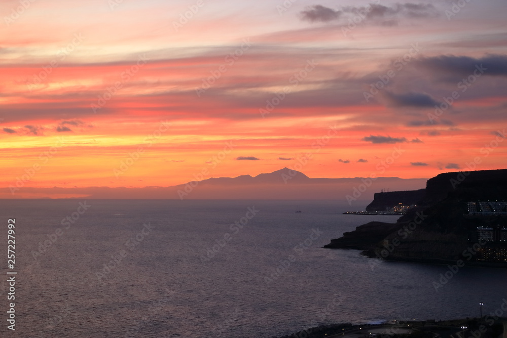 Sunset over Canary Islands, view from Gran Canaria to Tenerife, El Teide volcano, Spain Sunset over Canary Islands, view from Gran Canaria to Tenerife, El Teide volcano, Spain