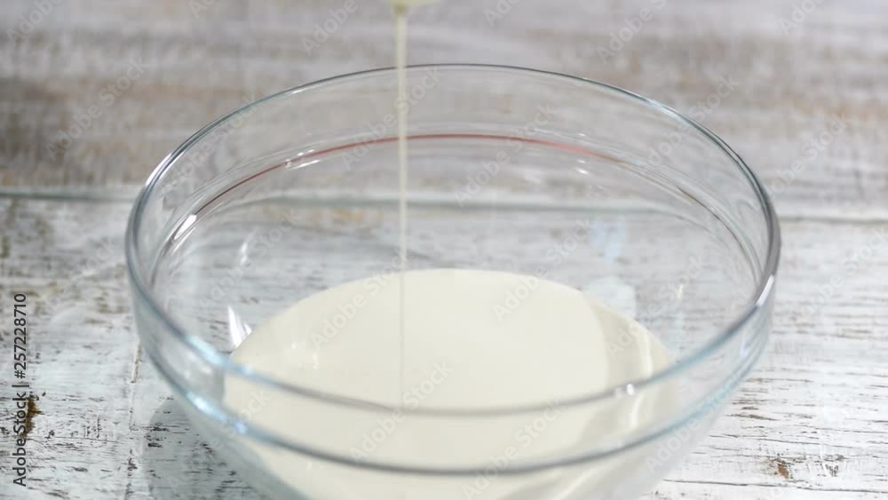 Whipping cream with hand mixer. Whipping cream with hand mixer.