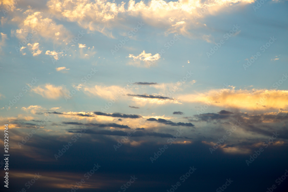 Bright blue sky with gentle cumulus clouds. Pink vanilla heaven. Natural summer and spring background. Bright blue sky with gentle cumulus clouds. Pink vanilla heaven. Natural summer and spring background.