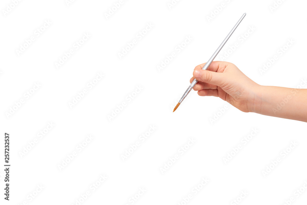 Kids hand with gray painbrush, painter concept Kids hand with gray painbrush, painter concept