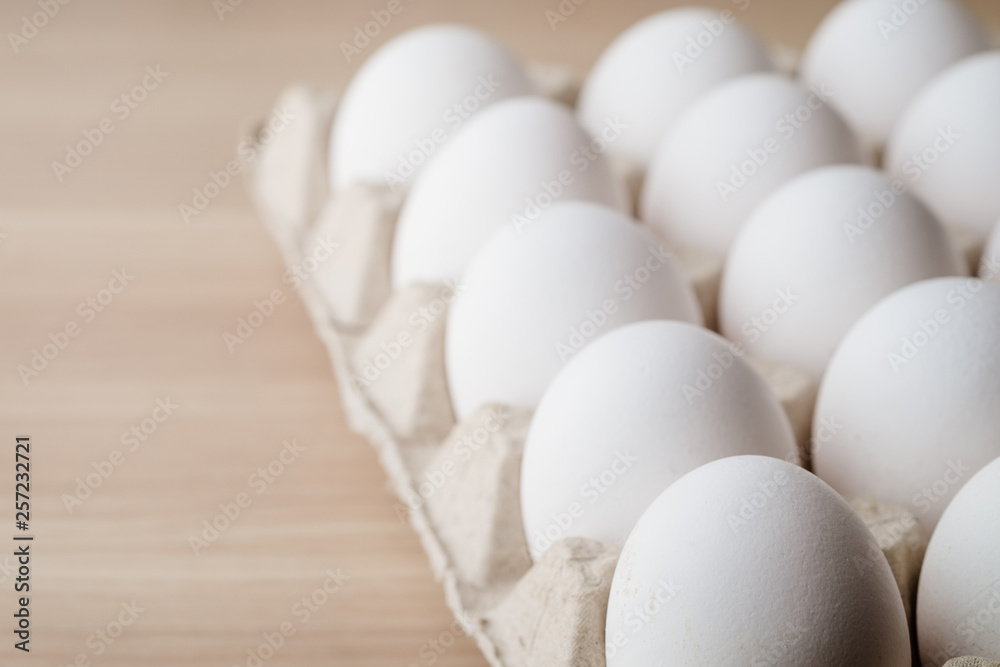 Many white chicken eggs food in tray box Many white chicken eggs food in tray box