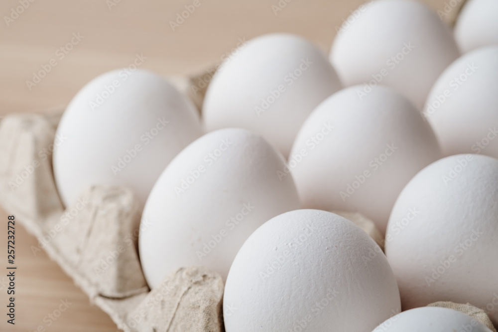 Many white chicken eggs food in tray box Many white chicken eggs food in tray box