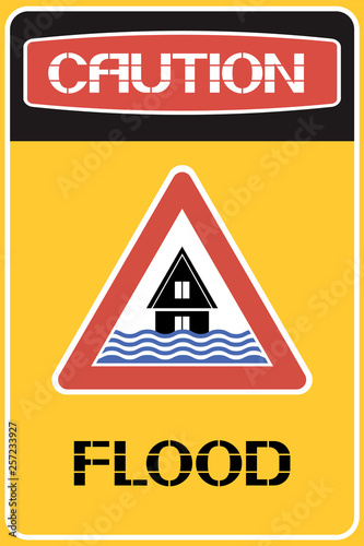 Caution. Flood. Sign. Information about the natural phenomenon dangerous to life and health in the area.