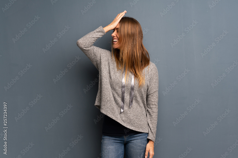Blonde woman over grey background has realized something and intending the solution Blonde woman over grey background has realized something and intending the solution