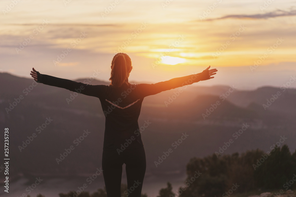 Fototapeta premium Sport lifestyle concept, Young sporty woman resting after running at the sunset