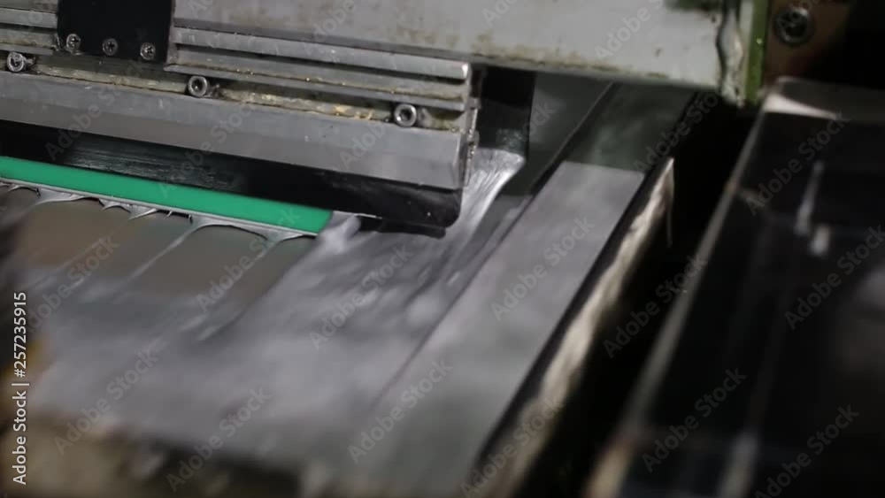 Close-up Of A Printing Press Putting Silver Paint On The Canvas Close-up Of A Printing Press Putting Silver Paint On The Canvas
