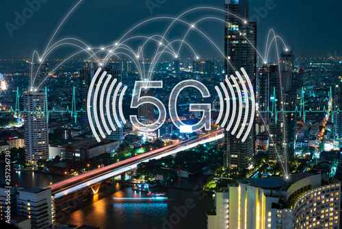 5G network digital hologram and internet of things on city background.5G network wireless systems.
