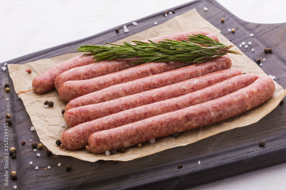 Food concept - Traditional raw horse meat sausage, top view Food concept - Traditional raw horse meat sausage, top view