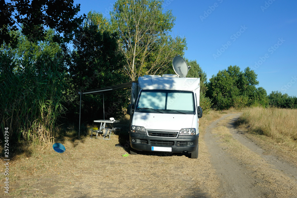 Motorhome parked on a small country lane