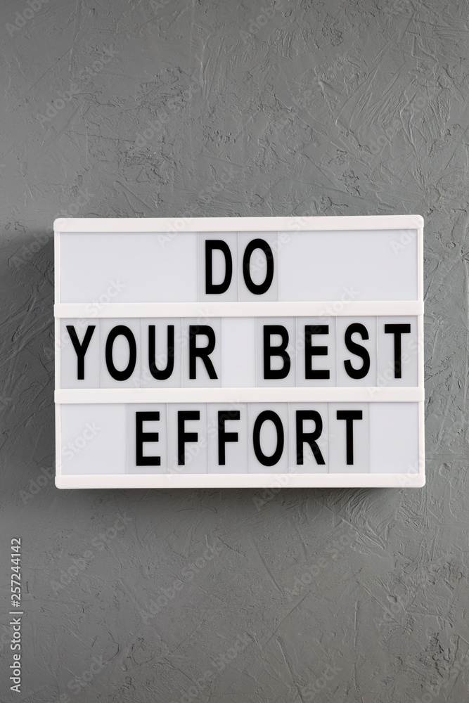 'Do your best effort' words on lightbox over concrete background, top view. Overhead, from above. Flat lay. 'Do your best effort' words on lightbox over concrete background, top view. Overhead, from above. Flat lay.