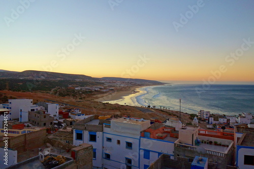 Sunrise over coastal village Taghazout in Southern Morocco known as surfing paradise near to Agadir