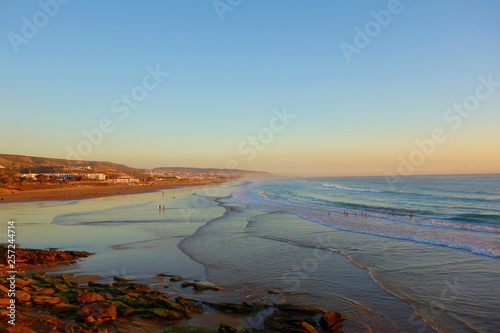 Sunrise over coastal village Taghazout in Southern Morocco known as surfing paradise near to Agadir