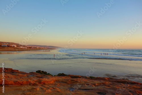 Sunrise over coastal village Taghazout in Southern Morocco known as surfing paradise near to Agadir