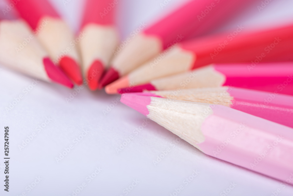 Macro photograph of several pencils of red color on a white background Macro photograph of several pencils of red color on a white background