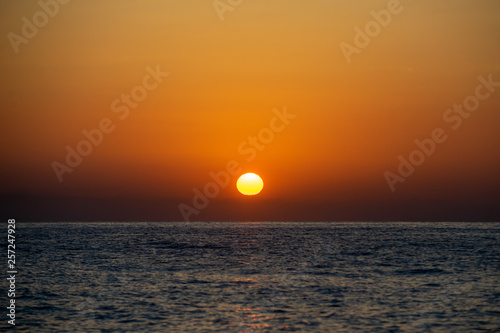 Fototapeta Naklejka Na Ścianę i Meble -  Early summer morning bright sky Beach in Crete